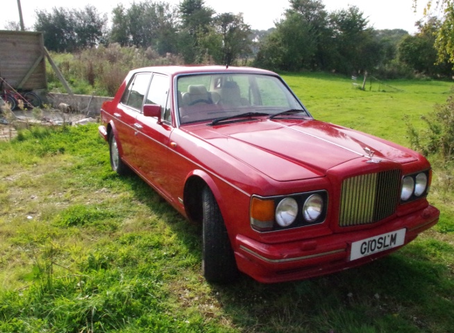 Vermillion Bentley Turbo R 1989 model year  15,600 Recorded miles ONLY. Believed to be genuine judging by engine compression statistics Rumoured to be originally  Owned  by Malaysian Royal Family. Runs well but needs work on body for MOT. To be recommissioned over autumn 2016.  Interior beige and many extra inlay wood panels.  Another fabulous gentlemans hot rod with added bling