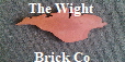 The Wight Brick Company. Manufacturing a very limited range of mini handmade and sometimes full size bricks from Isle of Wight clay and burnt in a kiln in Seaview. This picture shows aTerracotta Outline of the Isle of Wight