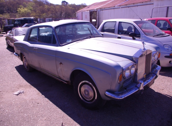 As received in April 2015. Silver Mink Rolls-Royce Corniche FHC 1971 Chassis No CRH 11573 One of only 1,100 produced 88,000 miles unused since 1988 with full historical build records.Interior blue leather  Brake and suspension overhaul, new sills  Full bare metal body respray. 4 New Whitewall tyres. Should be finished and MOT'd by end of 2016. Very much an appreciating investment Priced at over 30,000