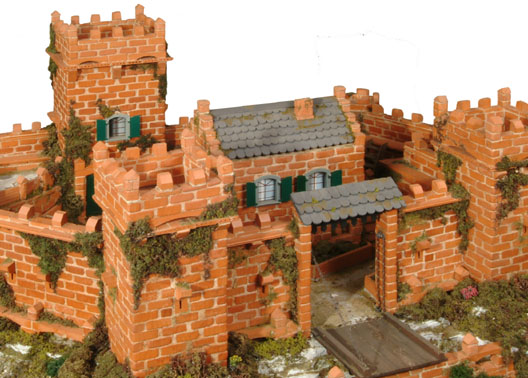 Toy brick kits including reuseable mortar.Construct different buildings from real bricks and cement. Includes, in most kits, bricks, cement with bowl and trowel, plastic doors / windows,  board to construct the models on and drawings for different building plans.