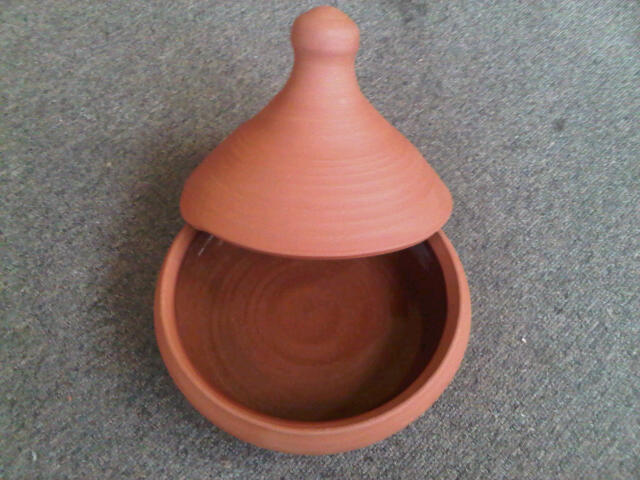 Tagine. A clay oven within an oven. when heated in the oven, the tagine creates a steamy enclosed environment. the steam rises from the cooking food, condenses on the lid of the pot and falls back into the food which means alls the goodness returns to the dish.